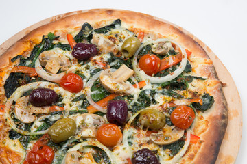 Vegetarian pizza or pizza with onions, mixed olives, mushrooms  and tomato with a white background