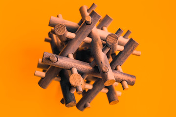 Wooden Brain Bamboo Puzzle on orange background