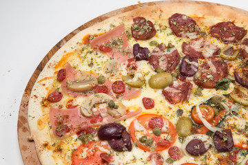 Salami pizza with mushrooms, onions, green olives  and tomato with white background