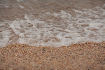 Texture of sea waves on the beach.