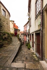 Fototapeta na wymiar Narrow Street of the Historical Old Town of Porto City in Portugal