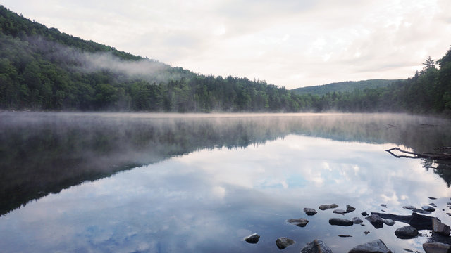 A scenic foggy view of Little Rock Pond along the Long Trail in Vermont.