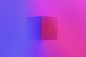 Geometric cube figure in vibrant neon colors. Faded blue and pink gradients, geometric shape,...