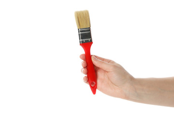 Female hand hold paint brush, isolated on white background