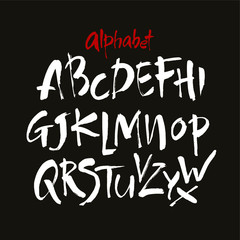 Vector Acrylic Brush Style Hand Drawn Alphabet Font. Calligraphy alphabet on a black background. Ink hand lettering.
