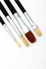 Four artists brushes isolated on a white background