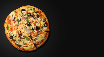 vegetable pizza on black background image