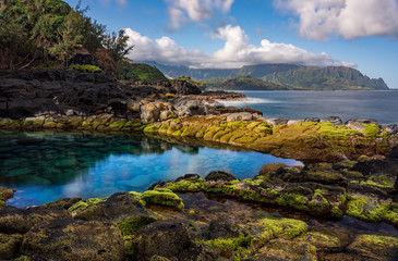 Naklejka na ściany i meble Long exposure of the calm waters of Queen's Bath, a rock pool off Princeville on north shore of Kauai