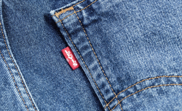 Levis red tag on denim, jeans texture. Levi Strauss is an american clothing  company. Moscow, Russia - December 23, 2019 Stock Photo | Adobe Stock