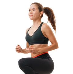 Fit woman in sportswear at step-aerobics class