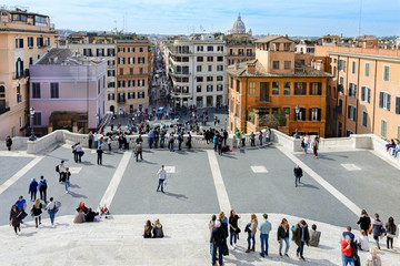 Obraz premium The Spanish Steps in Rome lead from Spanish Square to the Trinita dei Montina Church on top of Pincho Hill. At the foot of the Spanish Steps is the square with the fountain 