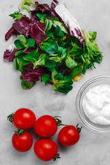 Obraz na płótnie Canvas Caesar salad ingredients on a light background