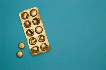 blister pack and pills on blue background - 327923787