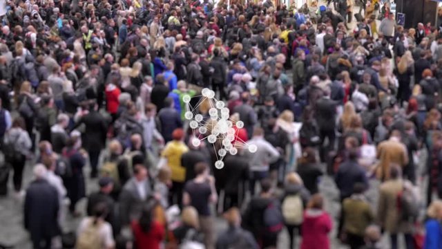 Coronavirus particles spreading in a crowd of people.  Visualization of coronavirus multiplying with a background of people at a train station concourse.