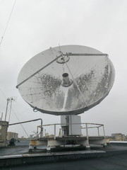 Satellite parabolic dish antenna on the roof for high speed internet link