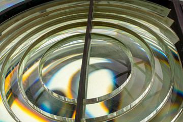 Close image of the glass prisms making up a fresnel lens in a lighthouse