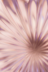 Abstract blurred background in the form of a flower and sun rays of pink color. Concept background, texture.