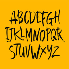 Vector Acrylic Brush Style Hand Drawn Alphabet Font. Calligraphy alphabet on a yellow background. Ink hand lettering.