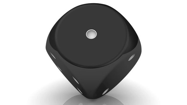 Black dice. One black dice rotating on a white surface. Footage video