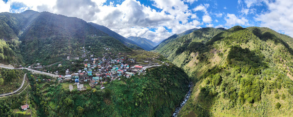 Fototapeta na wymiar aerial panorama of Banaue Rice fields with village/ Rice fields Panorama/Asian Agricultural Landscape 