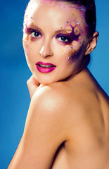 beauty young woman with creative make up, mystery tinsel