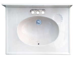 White ceramic discarded bathroom sink.