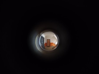 View to the hall through peephole eyelet in the door. Slovakia