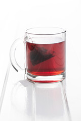 Fruit tea in glass mug.