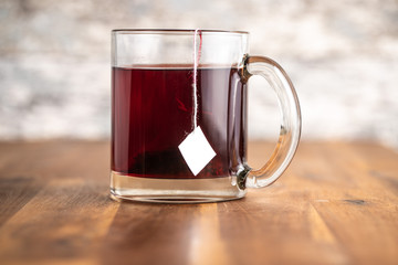Fruit tea in glass mug.