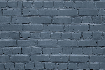 Background of brick wall, building facade texture, gray surface of brickwork, stone pattern.