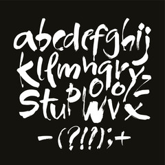 Vector Acrylic Brush Style Hand Drawn Alphabet Font. Calligraphy alphabet on a black background. Ink hand lettering.