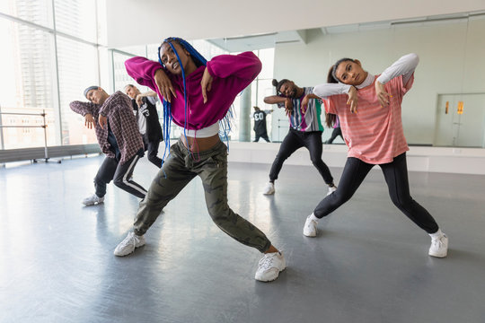 Young hip-hop dancers practicing in dance studio