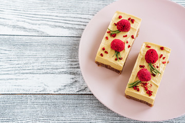 Mango cake. Freeze-dried raspberries and nuts. Raw dessert. Vegetarian healthy food