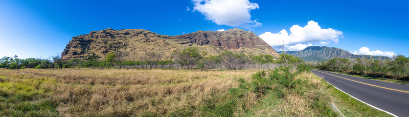 Fototapeta na wymiar Panoramic view of a road and mountains in Oahu Hawaii