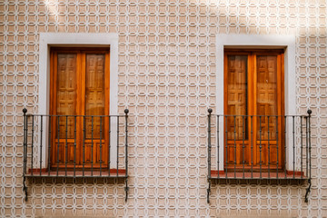 Typical spanish facade with windows and balconies, Segovia, Spain
