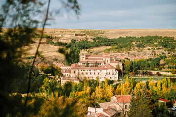 Obraz premium Cityscape of surroundings of Segovia with ancient houses and the Monastery of Saint Mary of Parral, Castilla y León, Spain
