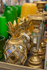 Trendy exotic golden pineapple shaped ceramic candlesticks, sconces, Arte Deco style home decoration, selective focus