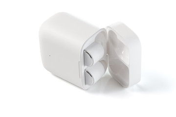  White Wireless Sport Headphones with Charging Box. Wireless in-ear Headphones for Jogging. Close Up View. Isolated on White Background.