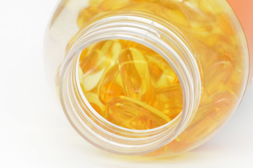 Fish oil capsules with omega 3 and vitamin D, healthy eating concept