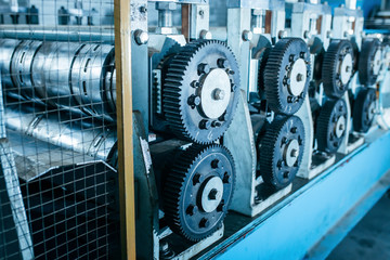 Plakat rusty mechanical gear wheels are part of industrial equipment