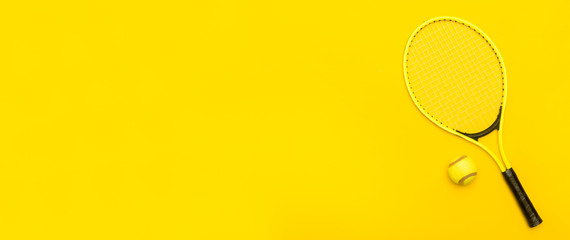 Top view of tennis rackets and ball on yellow background. Horizontal sport poster, greeting cards,...