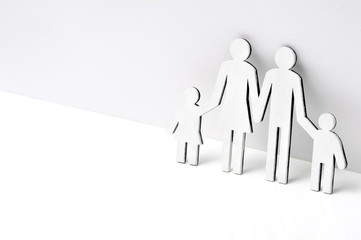 Happy family of wooden figures on a white background