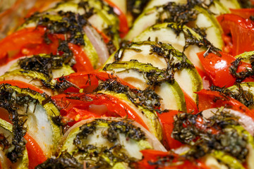 Fototapeta na wymiar chopped vegetables tomatoes, zucchini, onions, peppers folded into a baking dish. Cooking ratatouille