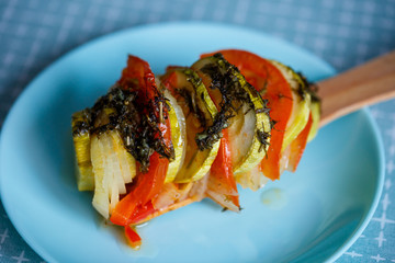 chopped vegetables tomatoes, zucchini, onions, peppers, in a plate. Cooking ratatouille