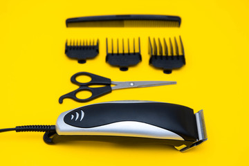 Set for a hairdresser on a yellow background. Top view. Copy, empty space for text