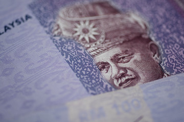 Malaysia currency of Malaysian ringgit banknotes background. Paper money of Hundred ringgit notes on etreme closeup. Financial concept.