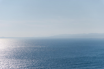 The panoramic view of the Mediterranean Sea and the hazy landscape on the horizon on a sunny day...