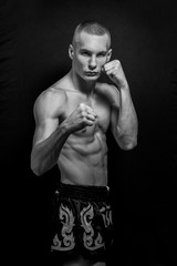 Obraz na płótnie Canvas Ready to fight, boxer, mma, fighter, low key, black background