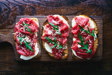 Italian sandwiches with mozzarella and beef carpaccio top view