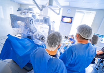 Team surgeon at work in operating room. Modern equipment in operating room. Medical devices for...